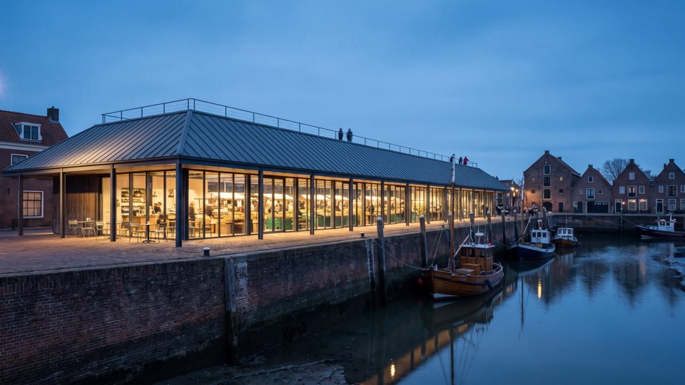 The market hall on the quay at dusk